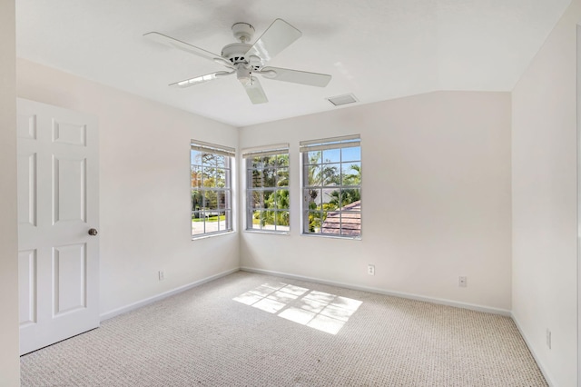 unfurnished room featuring lofted ceiling, light colored carpet, and ceiling fan