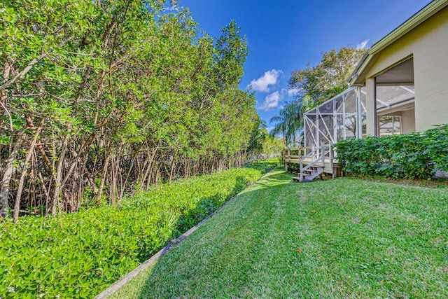 view of yard featuring a lanai