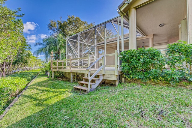 6481 Spartina Cir, Jupiter, FL 33458 - view of green lawn featuring glass enclosure and a deck