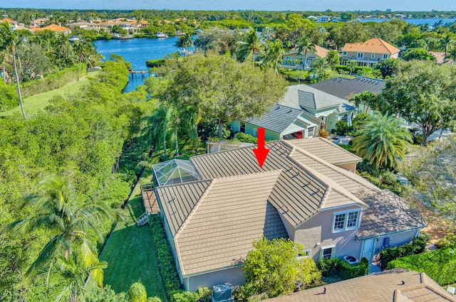 birds eye view of property with a water view