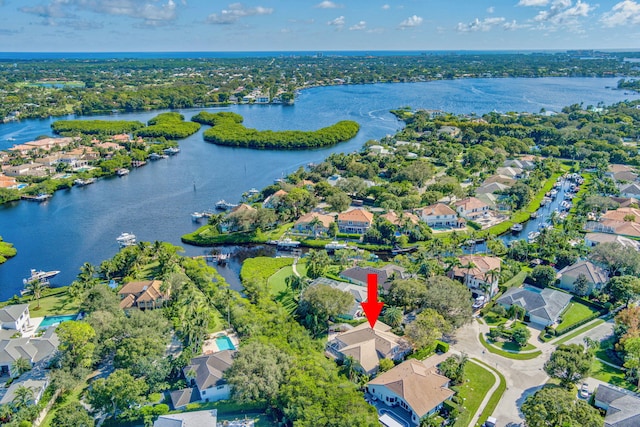 birds eye view of property with a water view