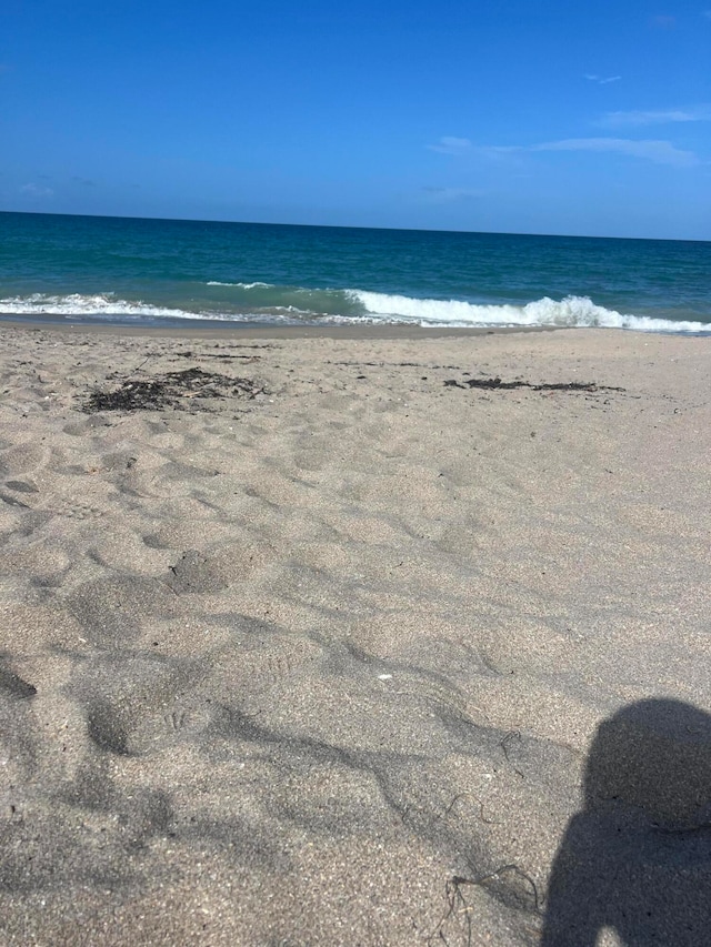 view of water feature with a beach view