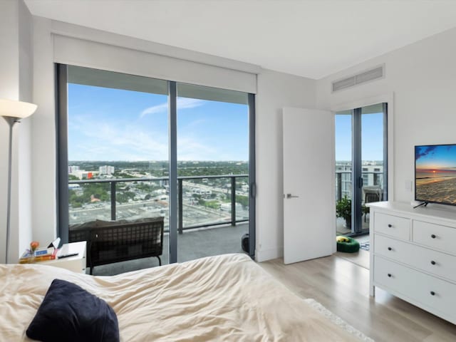 bedroom with light hardwood / wood-style flooring