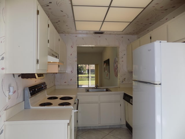 kitchen with white cabinetry, light tile patterned flooring, sink, and white appliances