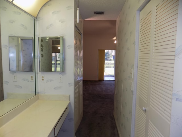 bathroom with vanity and a textured ceiling