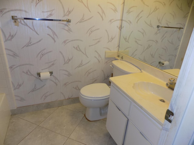 bathroom featuring vanity, toilet, and tile patterned flooring