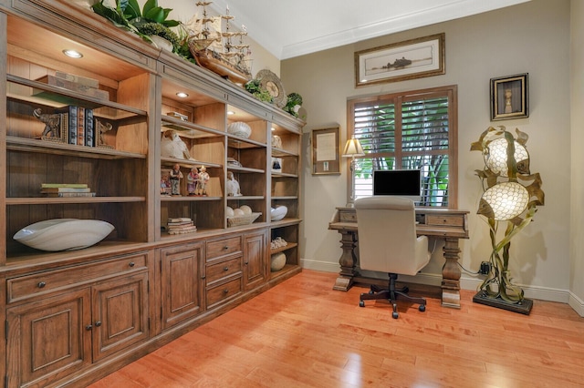 office area with crown molding and light hardwood / wood-style flooring