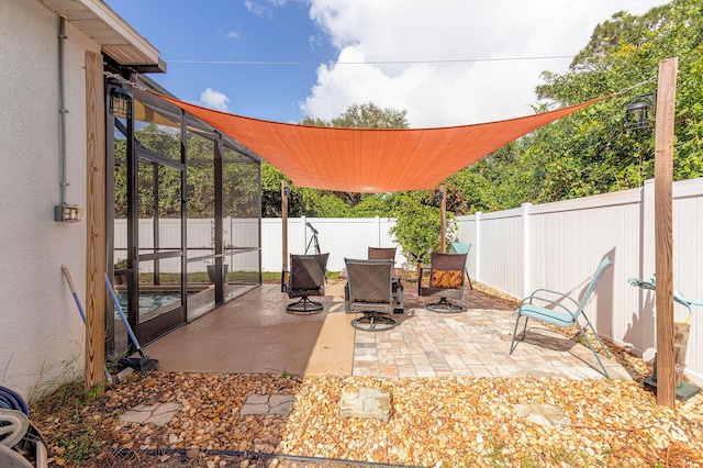 view of patio with a lanai