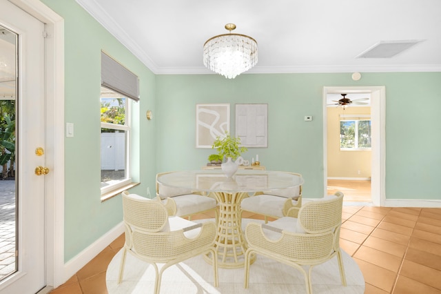 dining space with crown molding, light tile patterned floors, and ceiling fan with notable chandelier