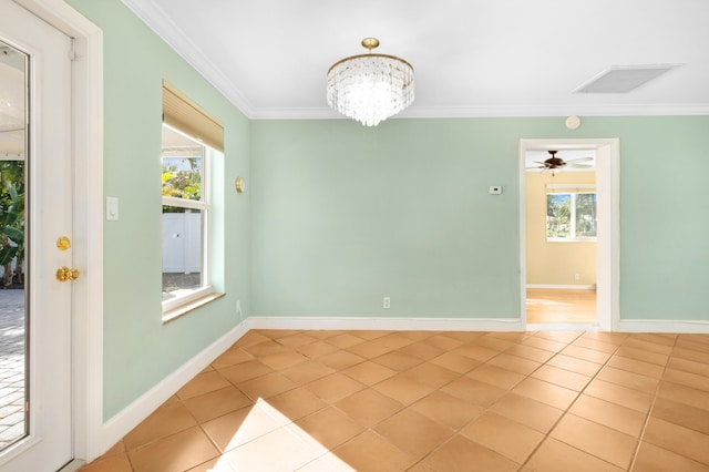 tiled spare room featuring ornamental molding and ceiling fan with notable chandelier