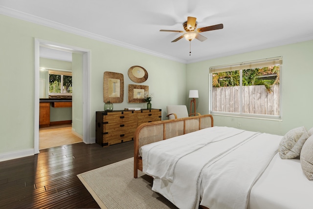 bedroom featuring ornamental molding, hardwood / wood-style floors, and ceiling fan