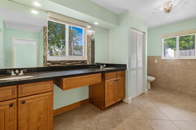 bathroom with vanity, a chandelier, toilet, and tile patterned floors