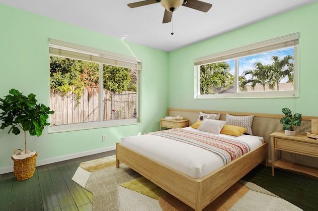 bedroom with hardwood / wood-style floors and ceiling fan