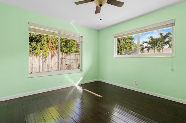 empty room with wood-type flooring and ceiling fan