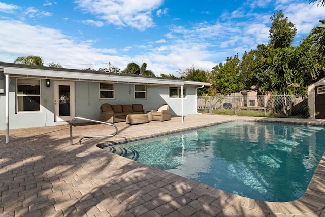 view of swimming pool with a patio and an outdoor hangout area