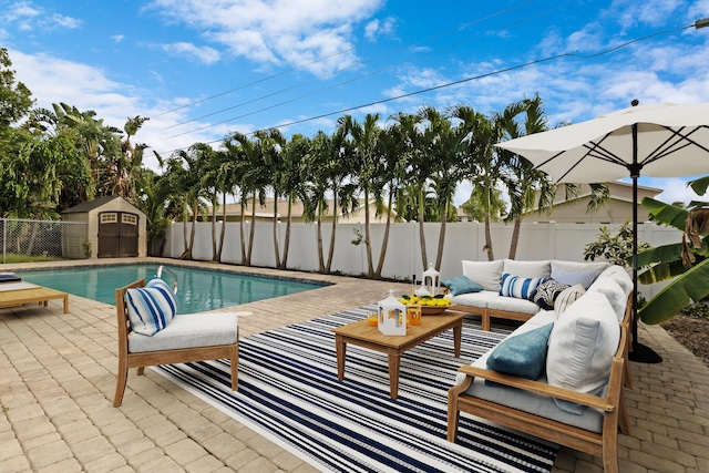 view of pool featuring a patio area, a storage unit, and outdoor lounge area