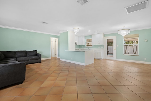 tiled living room with crown molding and a chandelier