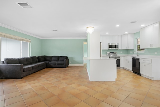 kitchen featuring ornamental molding, light tile patterned flooring, white cabinetry, plenty of natural light, and appliances with stainless steel finishes