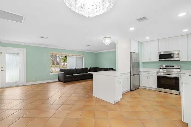 kitchen featuring appliances with stainless steel finishes, kitchen peninsula, white cabinetry, ornamental molding, and light tile patterned floors