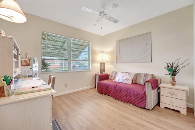 bedroom with light hardwood / wood-style floors and ceiling fan