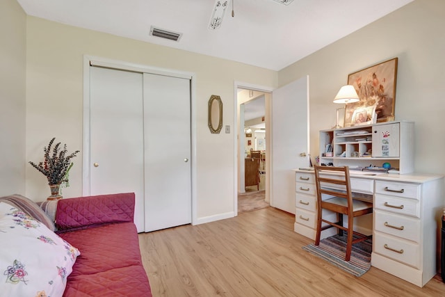 office area with light hardwood / wood-style floors