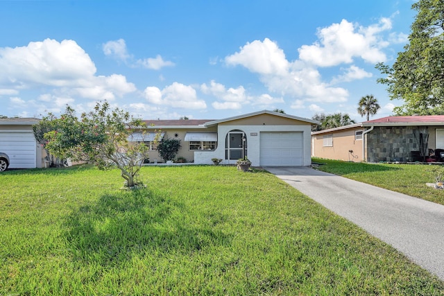 single story home featuring a front lawn and a garage