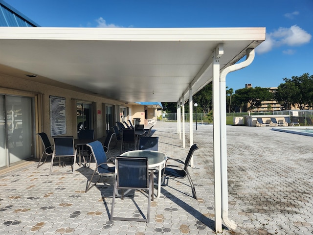 view of patio / terrace featuring a swimming pool