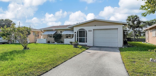 ranch-style house with a front yard and a garage