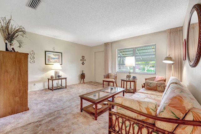 living room with light carpet and a textured ceiling