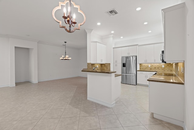 kitchen featuring crown molding, decorative light fixtures, stainless steel fridge with ice dispenser, a notable chandelier, and white cabinetry