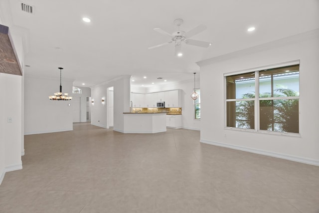 unfurnished living room with ceiling fan with notable chandelier, light tile patterned flooring, and crown molding