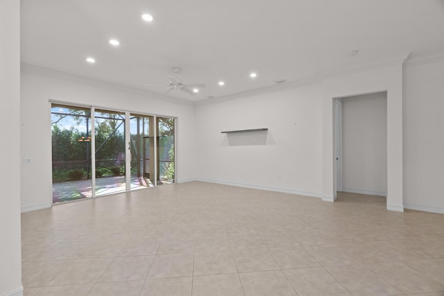 tiled spare room with ceiling fan and ornamental molding