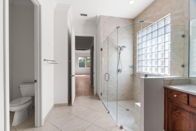 bathroom with an enclosed shower, ornamental molding, vanity, tile patterned flooring, and toilet