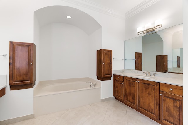 bathroom with tile patterned floors, crown molding, a bathtub, and vanity