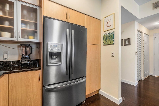 kitchen featuring light brown cabinets, stainless steel refrigerator with ice dispenser, and dark wood-type flooring