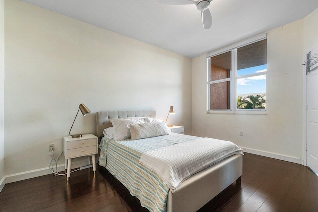 bedroom with ceiling fan and dark hardwood / wood-style flooring