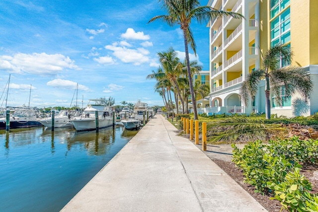 view of dock featuring a water view and a balcony