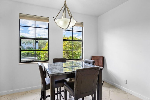 dining area with plenty of natural light and light tile patterned floors