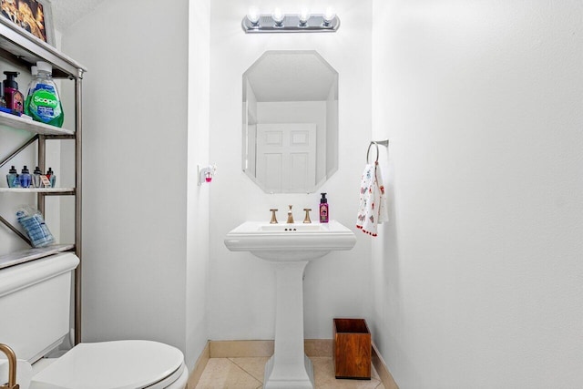 bathroom featuring tile patterned floors and toilet