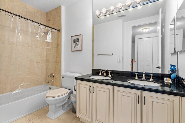 full bathroom with shower / bath combo, vanity, tile patterned flooring, toilet, and a textured ceiling