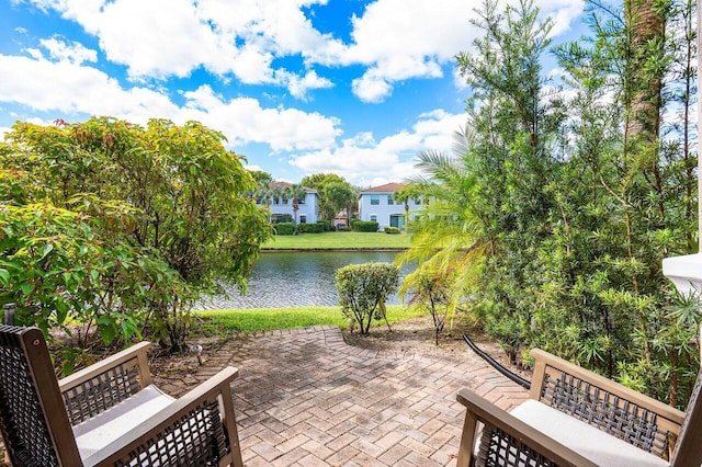 view of patio with a water view