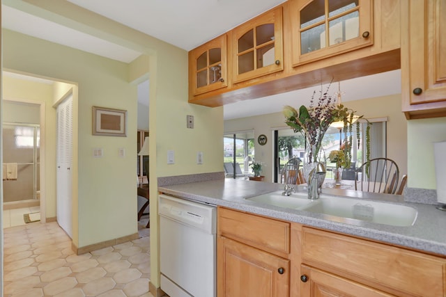 kitchen featuring light brown cabinetry, sink, and dishwasher