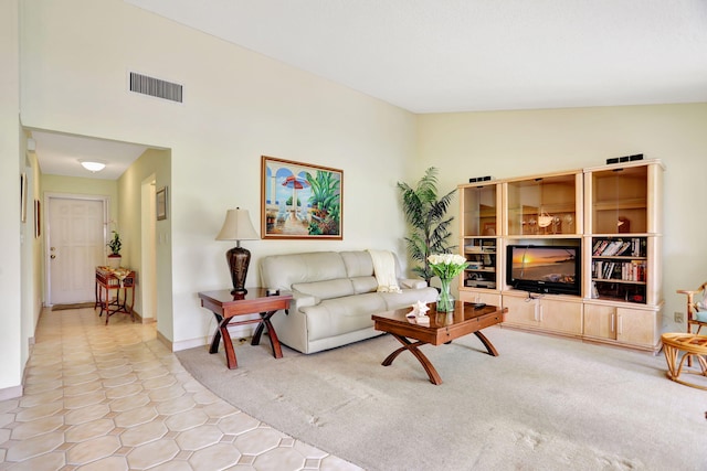 tiled living room with lofted ceiling