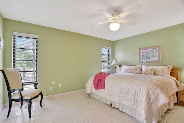 tiled bedroom with ceiling fan