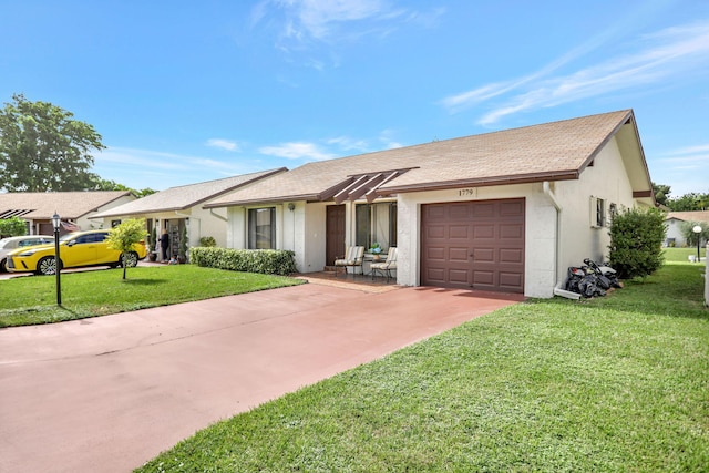 single story home featuring a front yard and a garage