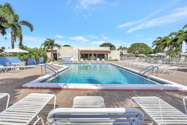 view of swimming pool with a patio area