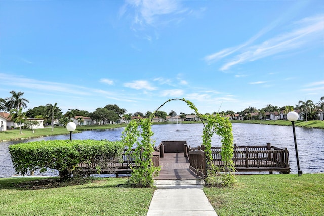 dock area featuring a yard and a water view