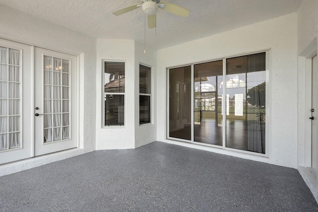 exterior space featuring ceiling fan