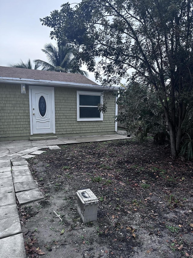 130 NE 4th Ave, Boynton Beach, FL 33435 - view of front facade with roof with shingles