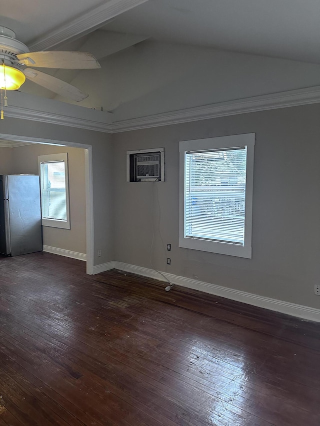 spare room featuring a wall unit AC, ceiling fan, vaulted ceiling, ornamental molding, and dark wood-type flooring